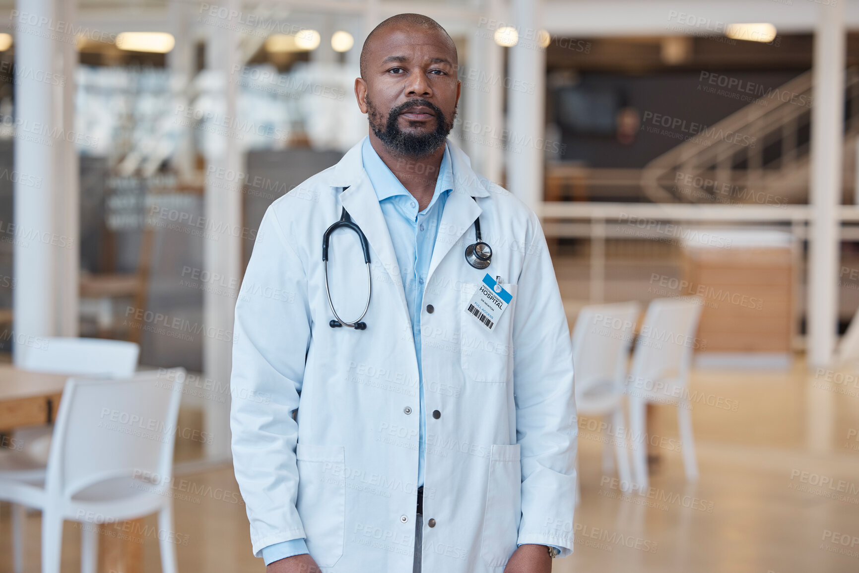Buy stock photo Portrait, black man and serious doctor in hospital for healthcare. African medical professional, face and surgeon, worker or confident employee from Nigeria for wellness, insurance and health service
