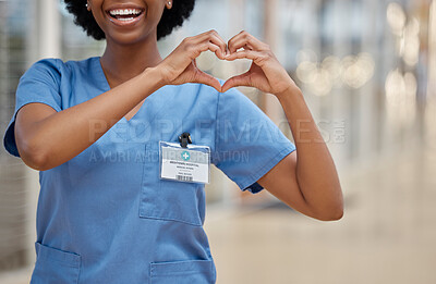 Buy stock photo Woman, nurse and heart hands for love, healthcare or passion in cardiology at the hospital. Hand of happy female person or medical professional show loving emoji, symbol or shape icon at the clinic