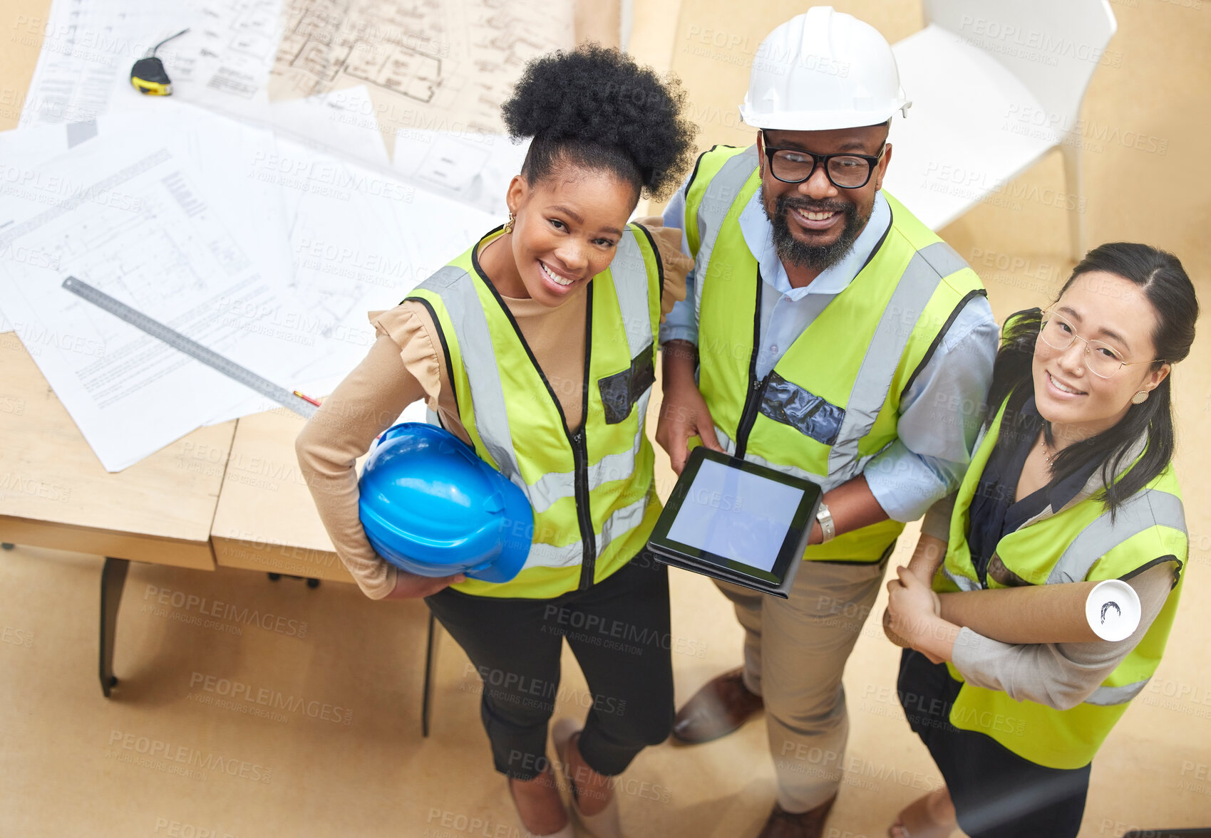 Buy stock photo Tablet, teamwork or portrait of engineers with designer planning a construction for architecture. Top view, blueprint or happy black people with Asian woman meeting together on a development project