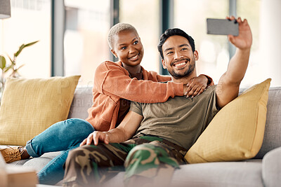 Buy stock photo Home, selfie and couple on a couch, love and happiness with romance, relationship and marriage. Social media, black woman and Asian man on a sofa, romantic and memory with profile picture and relax