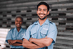 Portrait, security or safety and a happy man arms crossed with a black woman colleague on the street. Law enforcement, smile and duty with a crime prevention unit working as a team in the city