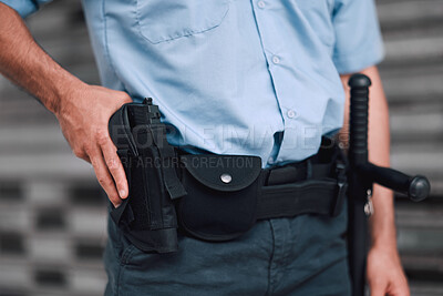 Buy stock photo Hand, gun and security with an officer on duty or patrol in the city for safety and law enforcement. Police, service and armed response with a guard outdoor in an urban town for crime prevention