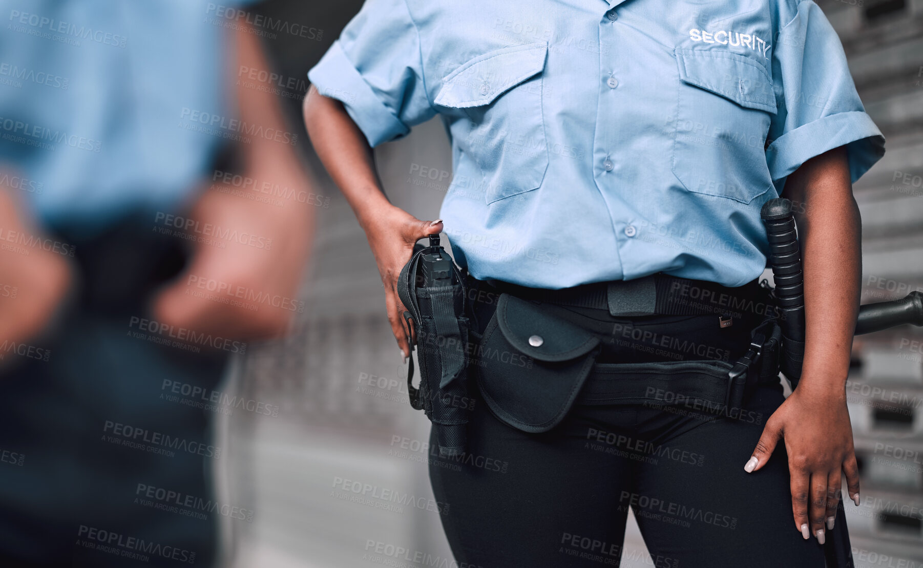 Buy stock photo Hand, gun and security with a guard on duty or patrol in the city for safety and law enforcement. Police, service and armed response with an officer outdoor in an urban town for crime prevention