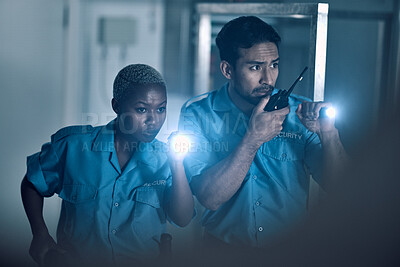 Buy stock photo Security, emergency and police investigate a crime in a store at night or in the evening for protection. Teamwork, walkie talkie and professional safety employees search a room for criminal danger