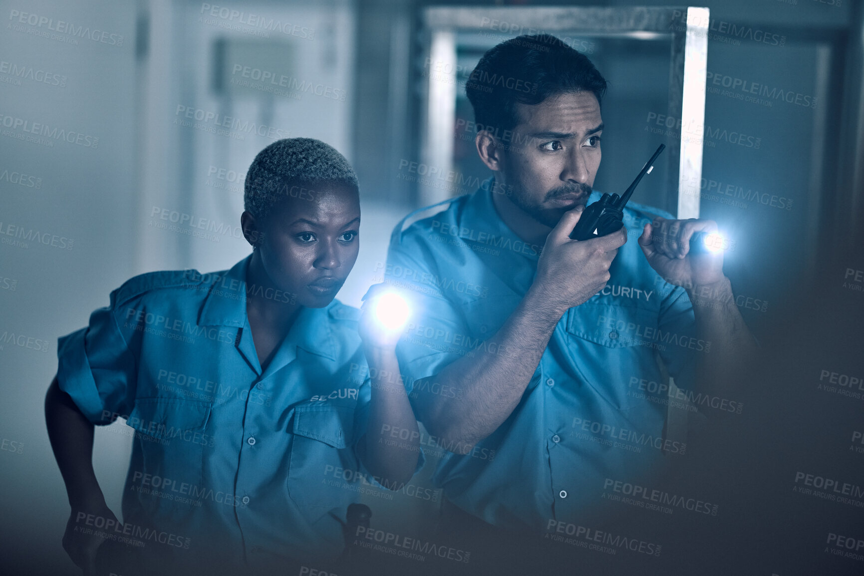 Buy stock photo Security, emergency and police investigate a crime in a store at night or in the evening for protection. Teamwork, walkie talkie and professional safety employees search a room for criminal danger