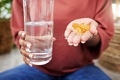 Buy stock photo Hand of woman, water and supplement pills for health, diet and commitment to nutrition or natural wellness product. Hands of girl with multivitamin tablet, drink in glass and organic healthcare drugs