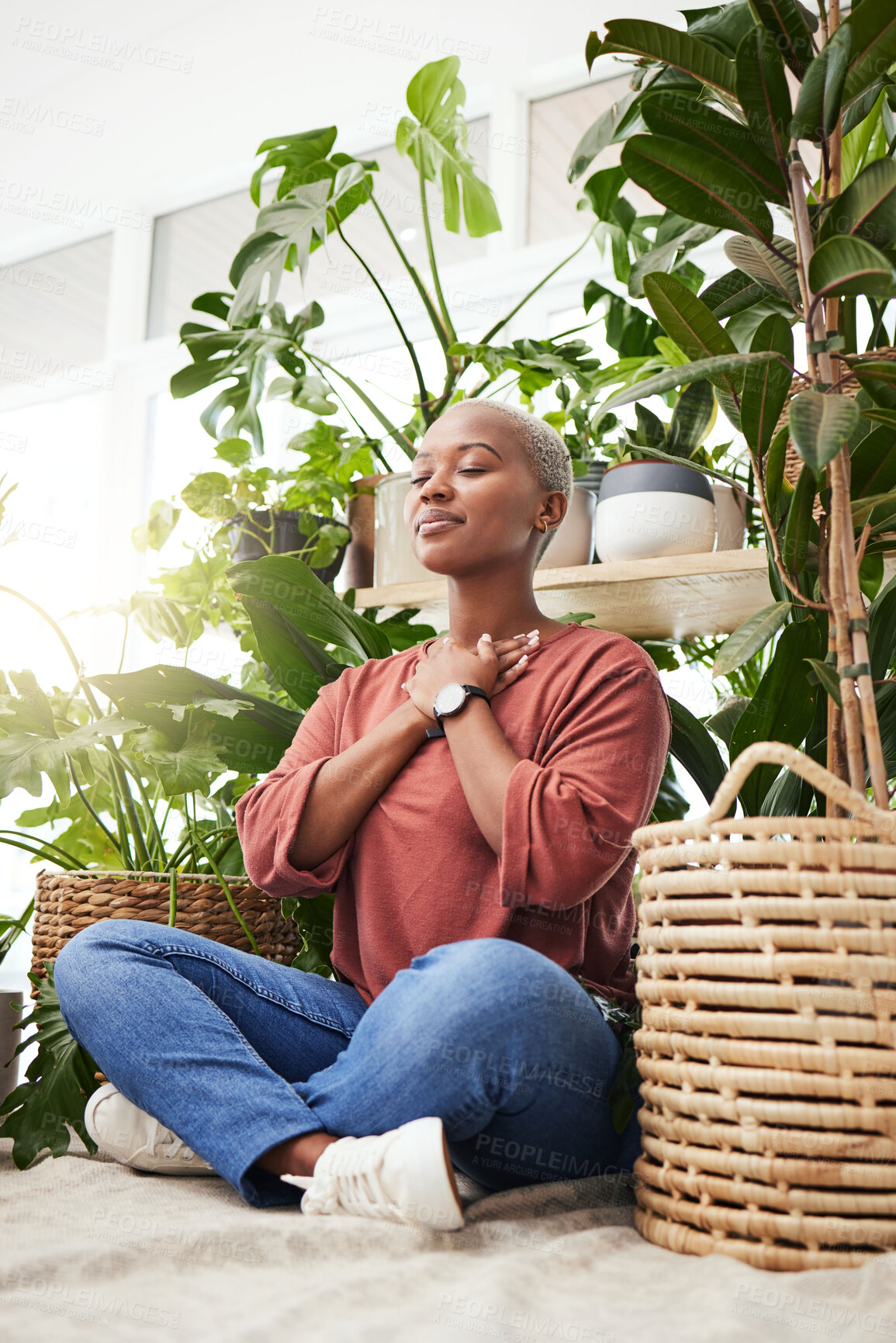 Buy stock photo Wellness, peace and woman breathing by plants for meditation in a natural greenhouse. Breathe, gratitude and young calm African female person with a relaxing zen mindset by an indoor nursery garden.