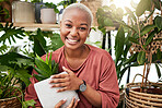 Happy, eco friendly and portrait of a woman with a plant in the nursery for a sustainable gift. Happiness, smile and African female person with green leaves in pot in greenhouse for gardening at home