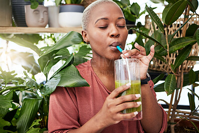 Buy stock photo Nutrition, drinking and black girl with green smoothie for diet with plants for wellness or weightloss. Healthy, woman and enjoy a detox drink with vegetables for vitamins with supplement in home.