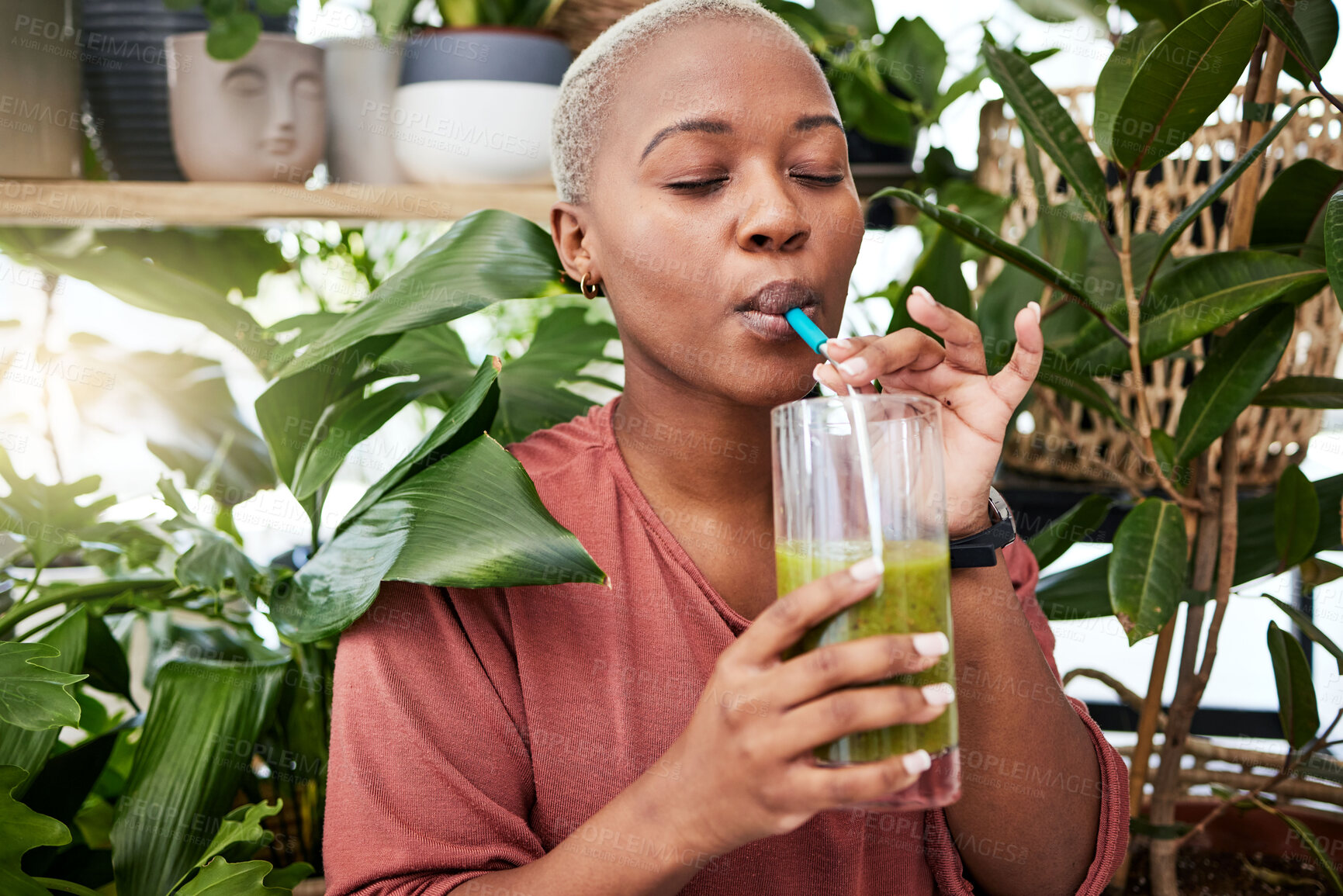 Buy stock photo Nutrition, drinking and black girl with green smoothie for diet with plants for wellness or weightloss. Healthy, woman and enjoy a detox drink with vegetables for vitamins with supplement in home.