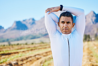 Buy stock photo Cyclist man, stretching arms or thinking of race, fitness or travel in nature for wellness by mountains. Warm up, countryside or healthy sports athlete ready to start training with active workout 