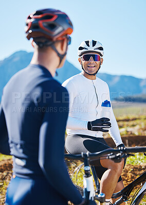 Buy stock photo Fitness, bike and friends drinking water in nature, taking a break from their cardio or endurance workout. Exercise, mountain and a man cyclist team in conversation while cycling in the countryside