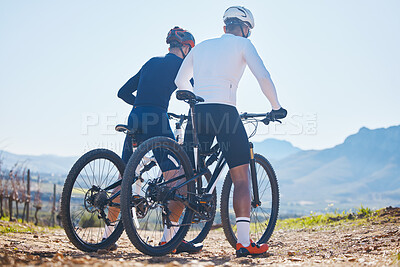 Buy stock photo Back, fitness and bike with friends in nature for cycling, taking a break from their cardio or endurance workout. Exercise, mountain and man cyclist team looking at the view while training for sports