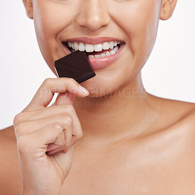 Buy stock photo Chocolate, bite and mouth of woman in studio eating luxury food, sweet treats and candy. Sugar, calories and face closeup of female person with cocoa, dessert and snack isolated on white background