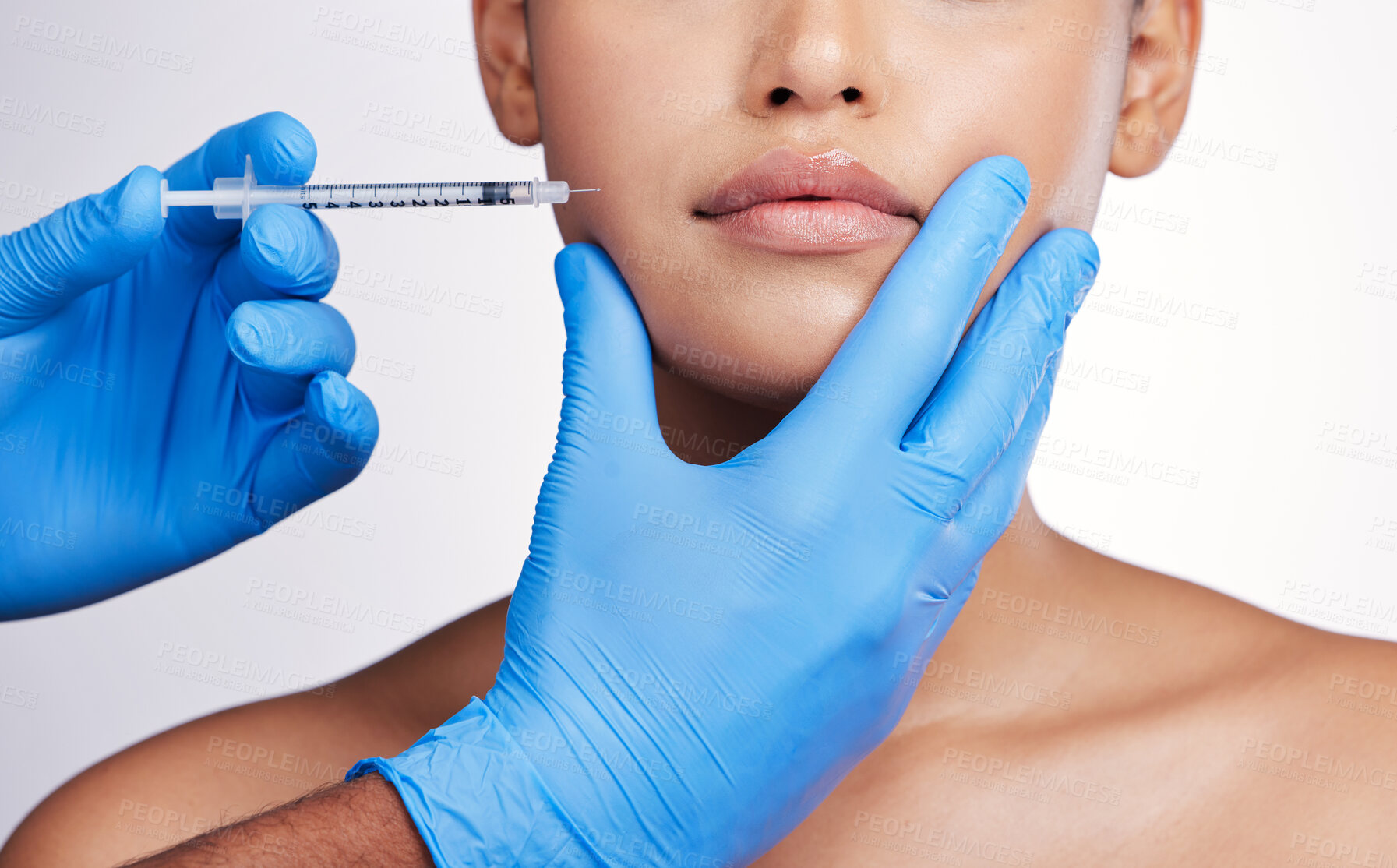 Buy stock photo Hands, injection and face with collagen, studio and cosmetic surgery for beauty, change and lip filler by white background. Surgeon, syringe and facial transformation for patient, service or skincare
