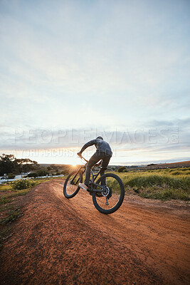 Buy stock photo Sports, cycling and man on bicycle in countryside for training, workout and exercise in nature. Fitness, cyclist and person with mountain bike for adventure, freedom and ride on outdoor dirt road