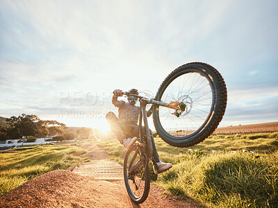 Buy stock photo Sports, cycling trick and man on bicycle in nature for training, workout and exercise in countryside. Fitness, morning and cyclist on mountain bike for adventure, freedom and adrenaline on dirt road
