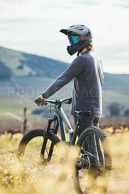 Buy stock photo Sports, cycling and man with helmet on bicycle in nature for training, workout and exercise in countryside. Fitness, cyclist and person with mountain bike for adventure, freedom and ride on dirt road