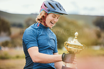 Buy stock photo Winner, trophy and achievement with a woman cyclist in celebration of victory outdoor after a race. Award, motivation and success with a happy young female athlete winning a cycling competition