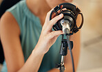 Microphone, hand and woman on podcast or live stream, closeup media broadcast for web radio host. Streaming, influencer or content creator with mic, internet recording and networking in home studio.