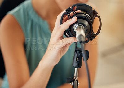 Buy stock photo Microphone, hand and woman on podcast or live stream, closeup media broadcast for web radio host. Streaming, influencer or content creator with mic, internet recording and networking in home studio.