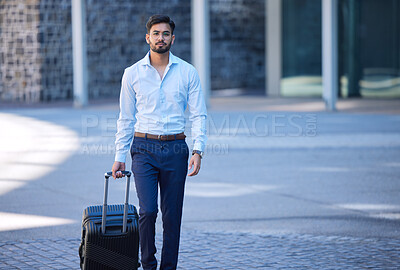 Buy stock photo Portrait, travel and a businessman with a suitcase in the city for a holiday or work trip in Singapore. Serious, worker and a male employee with luggage in town for a corporate journey or vacation