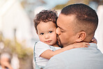 Love, dad and child hug, kiss and family bonding, support and trust in safety of parents embrace. Security, future hope and father with baby outside, hugging and spending safe quality time together.