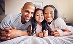 Family, portrait and relax on a bed at home with a smile and comfort for quality time. Man, woman or hispanic parents and a girl kid together in the bedroom for morning bonding with love and care