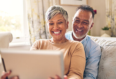 Buy stock photo Happy, selfie and a couple with a tablet on the sofa for communication, social media or online chat. Smile, house and a senior man and woman taking a photo on technology on the couch and laughing