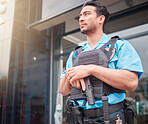 Security guard, safety officer and bodyguard man with a gun outdoor to patrol, safeguard and watch. Serious asian male at a building or property for crime prevention or armed response with a weapon