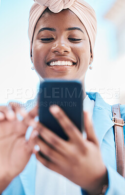 Buy stock photo Phone, business and black woman typing in city for social media, internet and online conversation. Travel, blue sky and face of happy female person on smartphone for chatting, website and networking