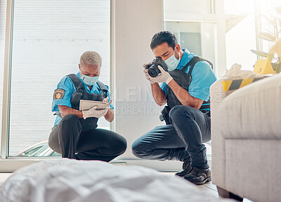 Buy stock photo People, police and investigation at the crime scene for murder, victim or case of death at home. CSI man and woman writing notes, pictures or photography for law enforcement or evidence in the house