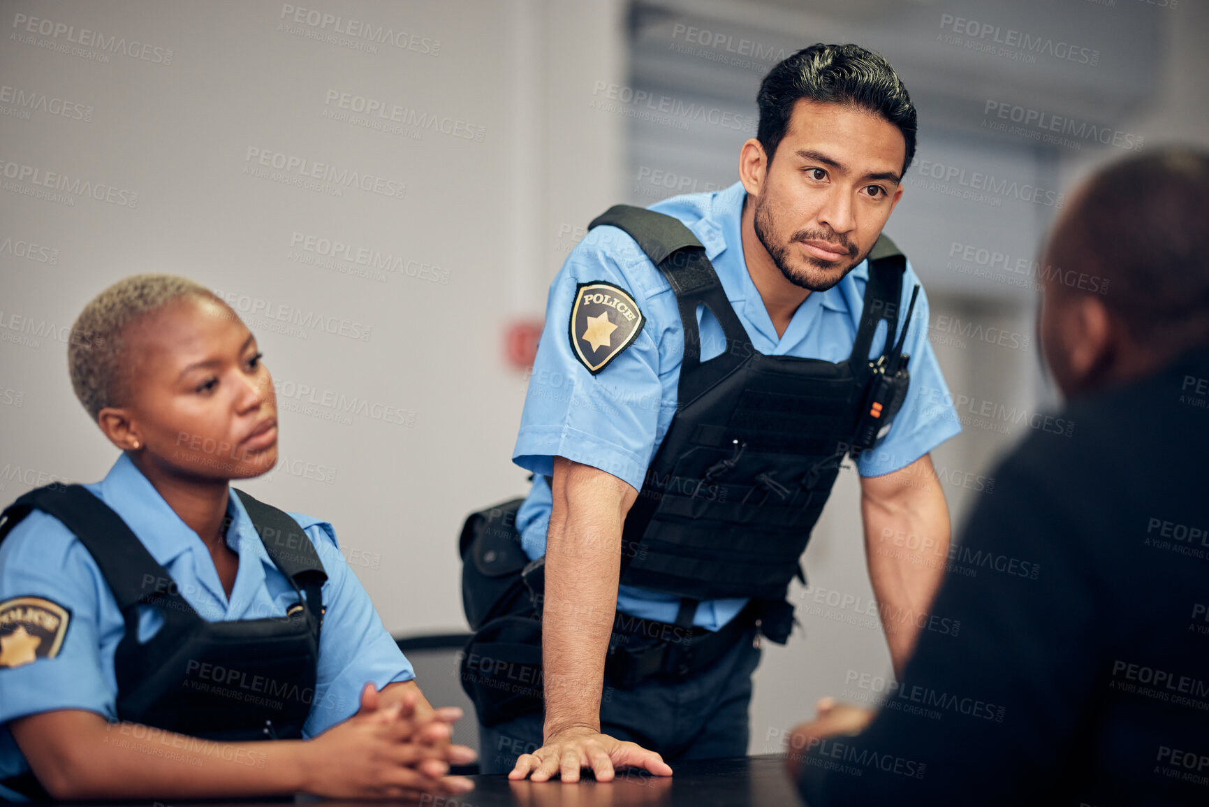 Buy stock photo Interrogation, arrest and police team with a suspect for questions as law enforcement officers. Security, crime or investigation with a serious man and woman cop talking to a witness for information