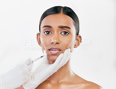 Buy stock photo Injection, scared and portrait of woman with face filler of beauty process on white background in studio. Cosmetics, indian female model and fear of needle, plastic surgery or aesthetic facial change