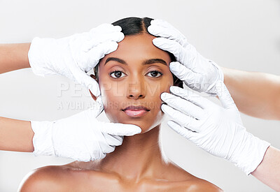 Buy stock photo Woman, plastic surgery and hands in studio portrait with beauty, skincare and face with process by white background. Change, model and doctors gloves for transformation, cosmetics or facial aesthetic