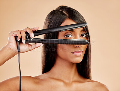 Buy stock photo Flat iron, hair and woman with beauty, portrait and hairstyle with appliance isolated on studio background. Keratin treatment, electric straightener and heat, Indian female model with cosmetology 