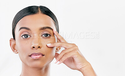 Buy stock photo Beauty, hand on face and portrait of a woman with natural skin glow isolated on a white background. Dermatology, makeup and cosmetics of Indian female model for facial shine or self care in studio