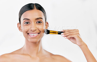 Buy stock photo Portrait, indian woman and brush for face makeup, cosmetics and aesthetic tools on white background, mockup space or studio. Happy female model brushing facial beauty product, foundation and skincare