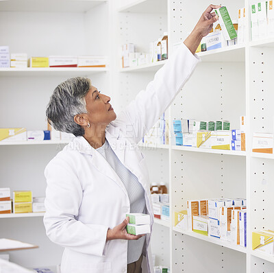 Buy stock photo Mature pharmacist woman, shelf and boxes with thinking, packing stock and inventory inspection. Senior pharmacy manager, package or product for healthcare, pills or ideas with drugs in retail store