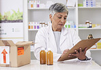 Woman, doctor and clipboard at pharmacy for inventory inspection, logistics or delivery at drug store. Senior female person, medical or healthcare professional checking pharmaceutical stock or list