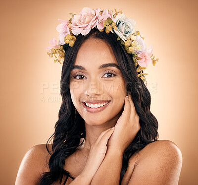 Buy stock photo Portrait, smile and flower crown with a model woman in studio on a brown background for shampoo treatment. Beauty, salon and hair with a happy young person looking confident about natural cosmetics