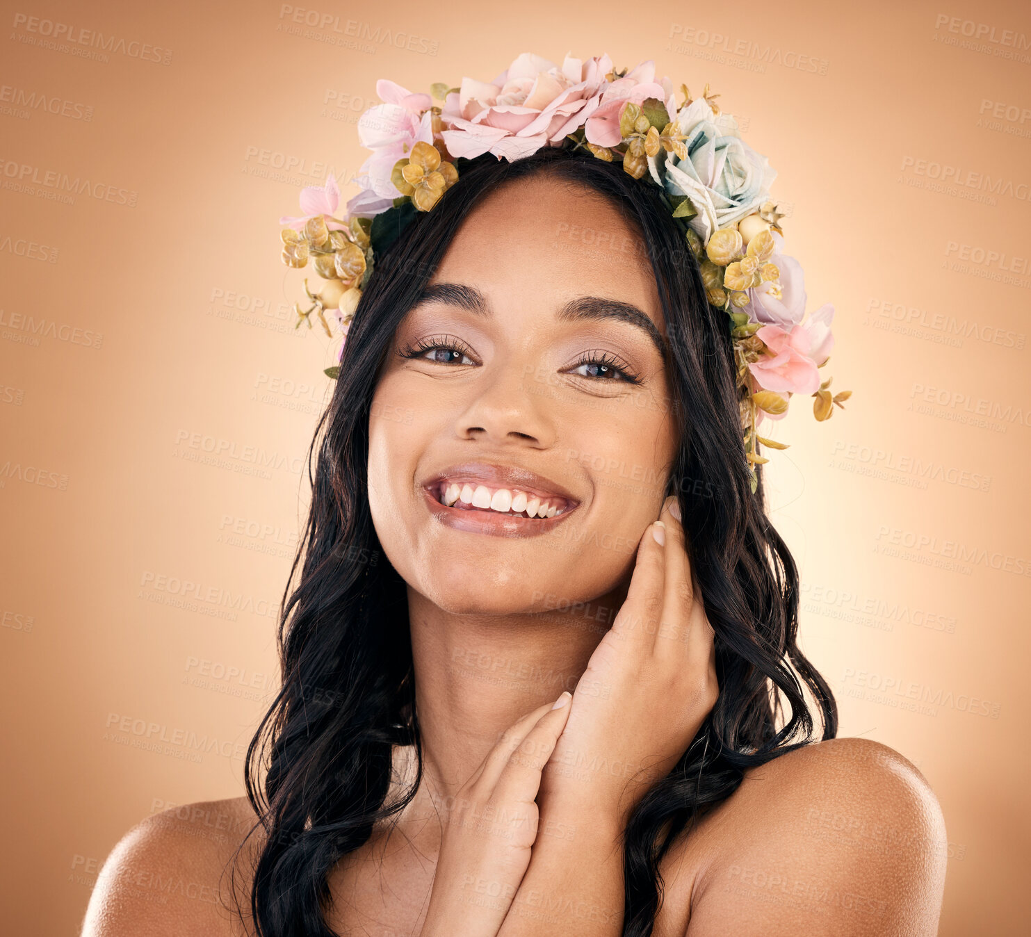 Buy stock photo Portrait, beauty and flower crown with a model woman in studio on a brown background for shampoo treatment. Smile, salon and hair with a happy young person looking confident about natural cosmetics