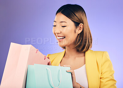 Buy stock photo Check, shopping bag and young woman for fashion sale, discount or retail prize on studio, purple background. Excited model, asian person or happy customer with choice, giveaway and wealth or gift