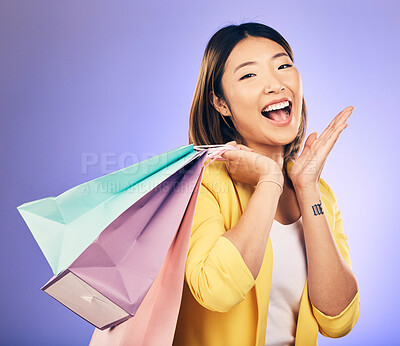 Buy stock photo Shopping bag, wow portrait and woman of beauty discount, retail announcement or sale on purple studio background. Cosmetics, excited face and young customer or asian person for prize, gift or winning