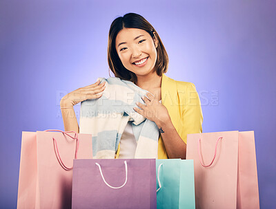 Buy stock photo Shopping bag, portrait and woman for clothes sale, discount or giveaway promotion on studio, purple background. Happy young model, customer or asian person for fashion choice, retail or unboxing gift