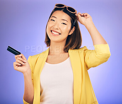 Buy stock photo Credit card, sunglasses portrait and woman shopping, retail banking and finance, e commerce or paperless payment. Happy customer, model or asian person with fashion loan on studio, purple background