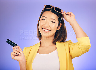 Buy stock photo Credit card, shopping portrait and woman in sunglasses, retail banking and finance, e commerce or payment. Happy customer, fashion model or asian person for debit pay on studio purple background
