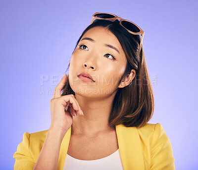 Buy stock photo Thinking, glasses and wondering with asian girl or idea in purple background in studio with decision. Choice, contemplation and woman with creative thought or face and person or option for solution.