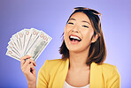 Money fan, portrait and woman or winner with bonus, financial success and winning, college loan or lottery. Happy asian person or student with scholarship cash or funding on studio, purple background