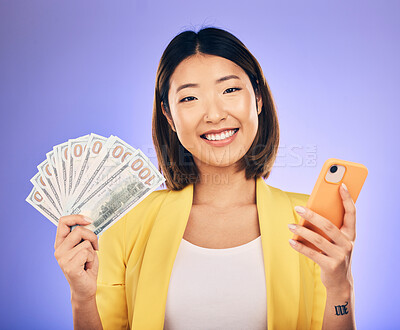 Buy stock photo Money, phone and woman in portrait winning, finance or online savings, profit and cash prize. Success, lottery and winner or asian person on mobile, money fan and banking on studio, purple background